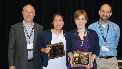 Helen Hsu-Kim and Grace Schwartz with awards